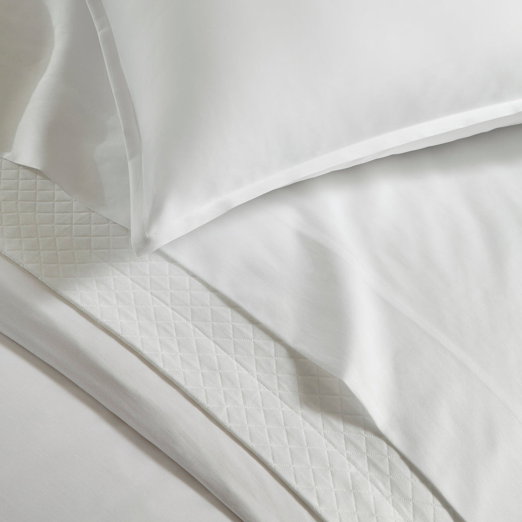 Giza 45 Corto Sateen Duvet Cover, Sheets, and Shams in White from luxury bedding designer Sferra Fine Linens