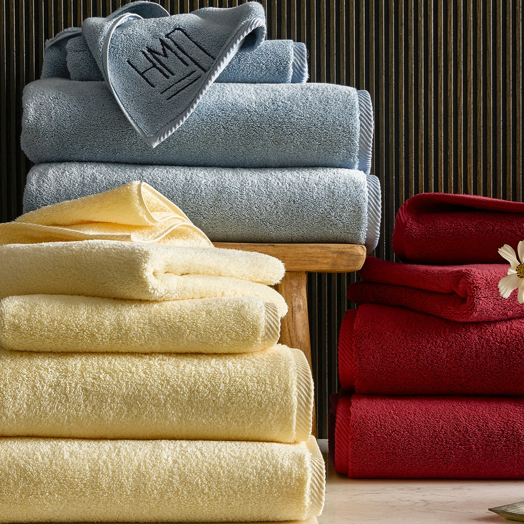 Matouk Milagro Plush Luxurious Bath Towels in Hazy Blue, Butter Yellow, and Scarlet Red