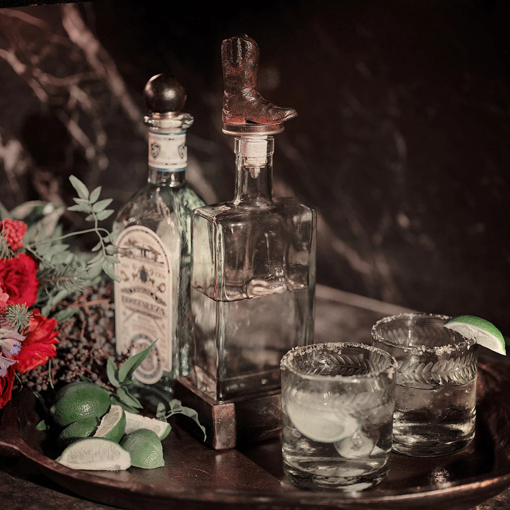 Jan Barboglio Wayne glass decanter with iron cowboy boot stopper