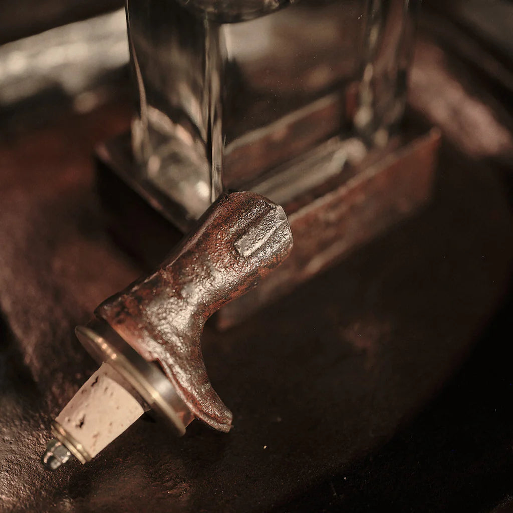 Jan Barboglio Wayne glass decanter with iron cowboy boot stopper