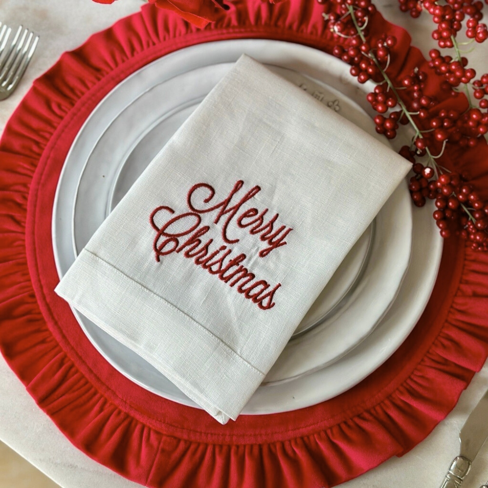 Arte Italica Merry Christmas Tri-Fold Napkin in White linen with red embroidered "Merry Christmas" in script font