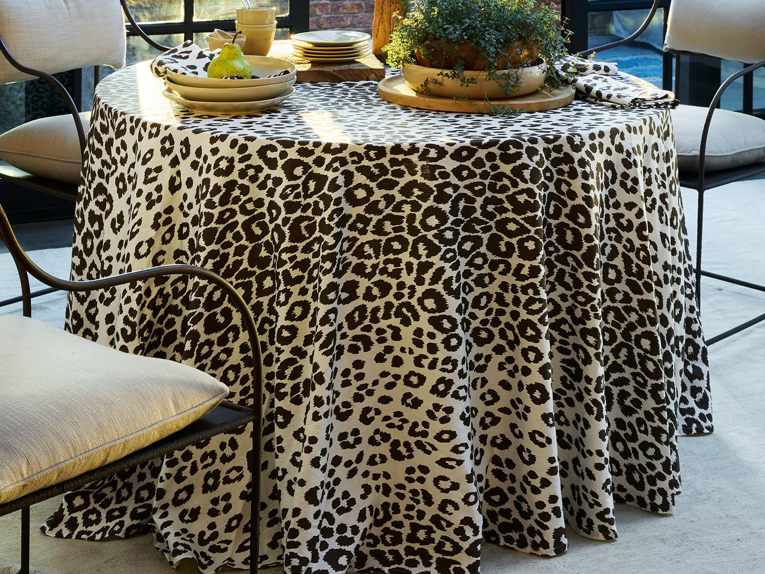 https://www.thepicketfence.com/cdn/shop/products/Table_Style_Hero_IconicLeopard_Sable.jpg?v=1663714838