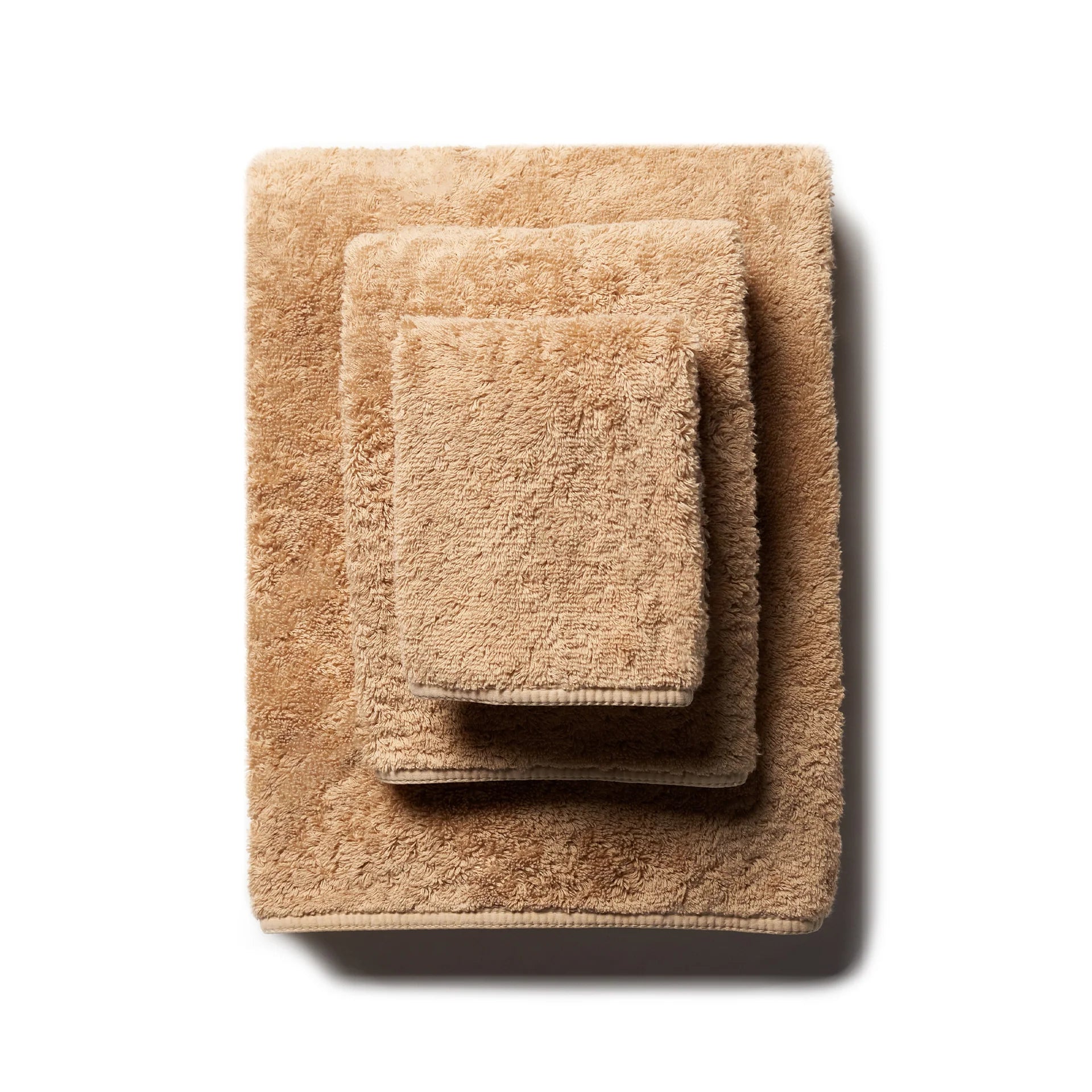 https://www.thepicketfence.com/cdn/shop/products/indulgence-bath-towels-scandiahome-bronze-stacked-web.webp?v=1681936160